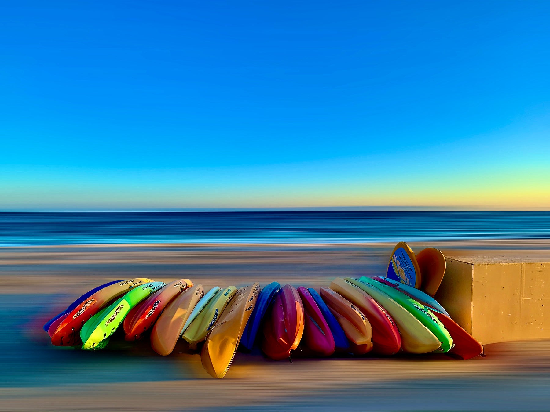 Kayaks of East Beach by John Behring